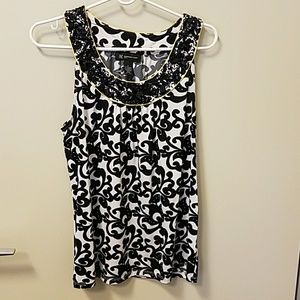 Sleeveless top with beaded neckline